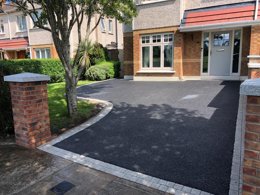 Laying tarmacadam surfacing in Ockham, Surrey