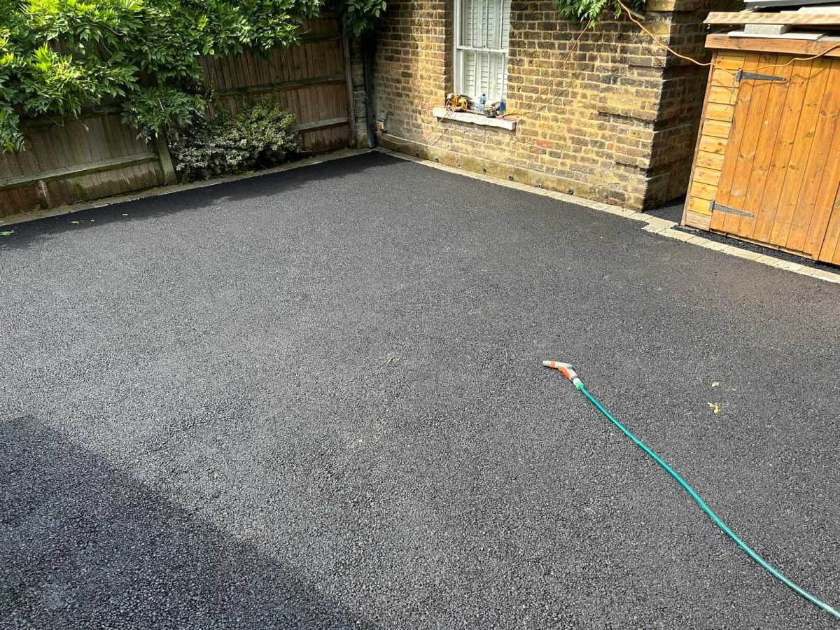 Laying tarmac surfacing in Stoke D'Abernon, Surrey