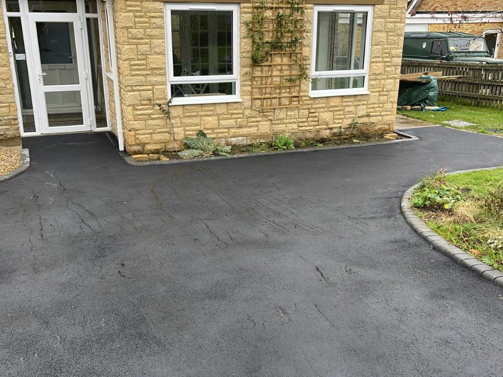 Laying asphalt surfacing in Windlesham, Surrey