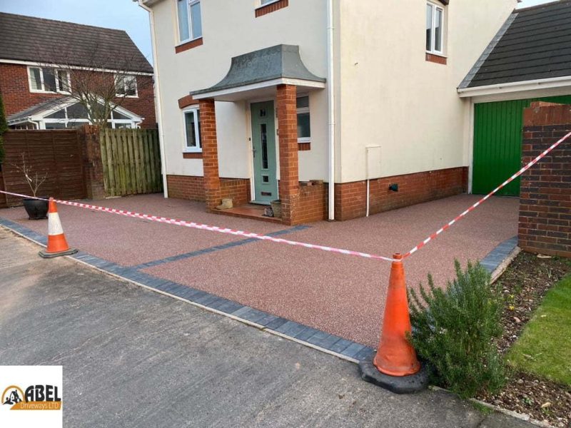 Red chipped resin finish on driveway
