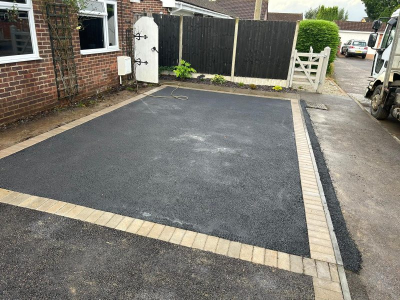 Asphalt driveway with border paving